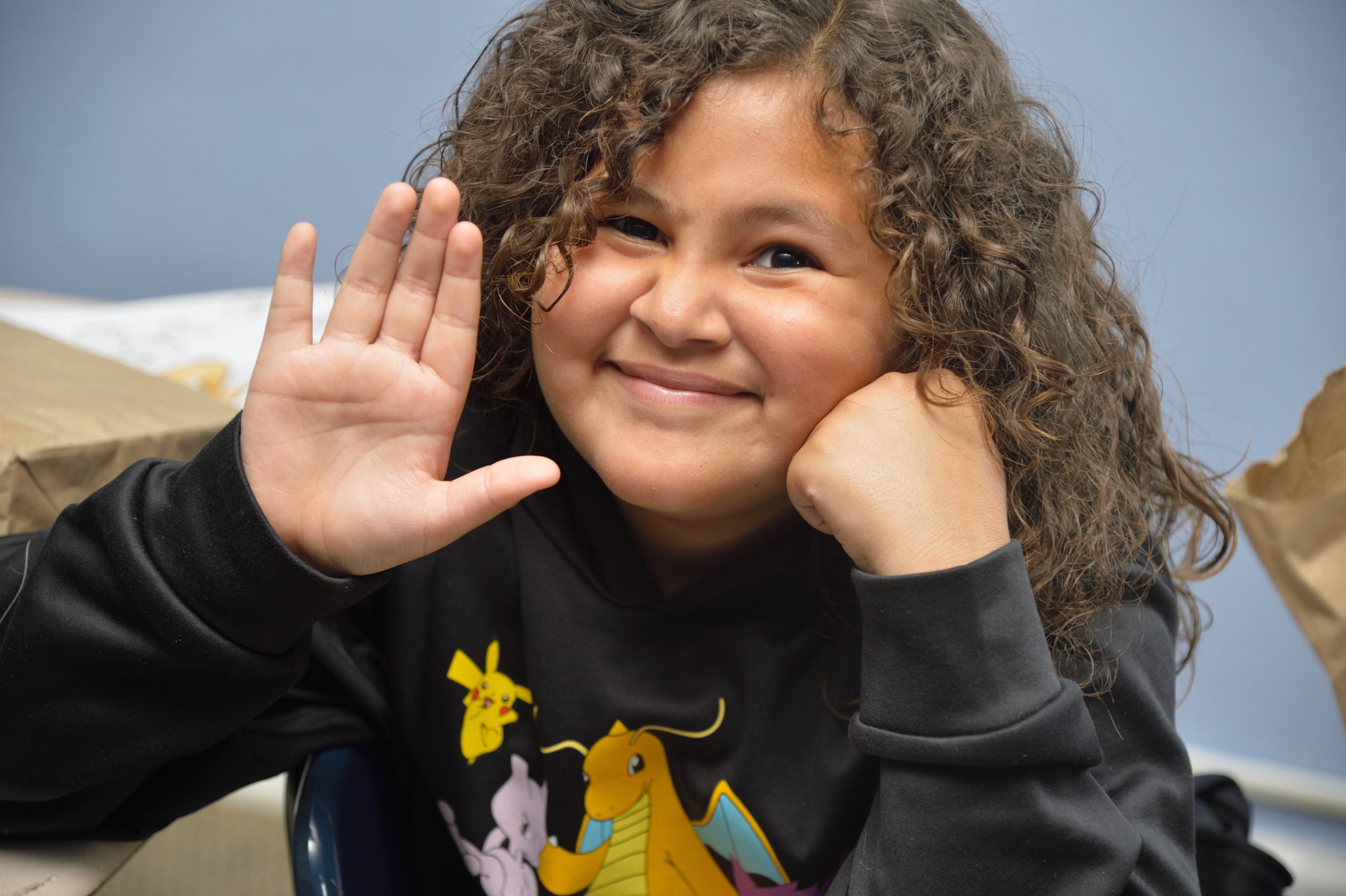 Student waving